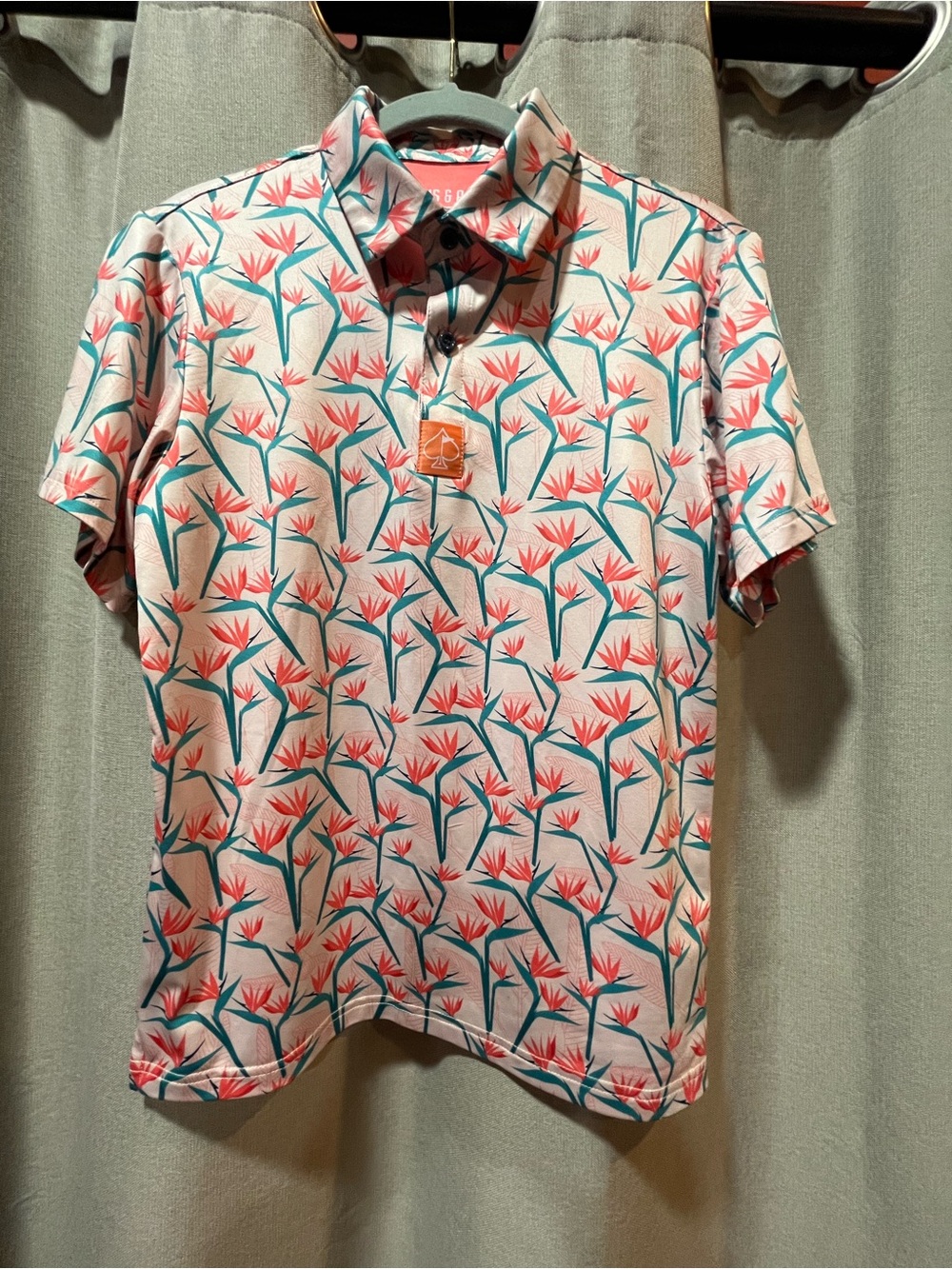 YOUTH SIZE L Floral Print Polo Shirt Coral & Teal. measures 18 inch across chest